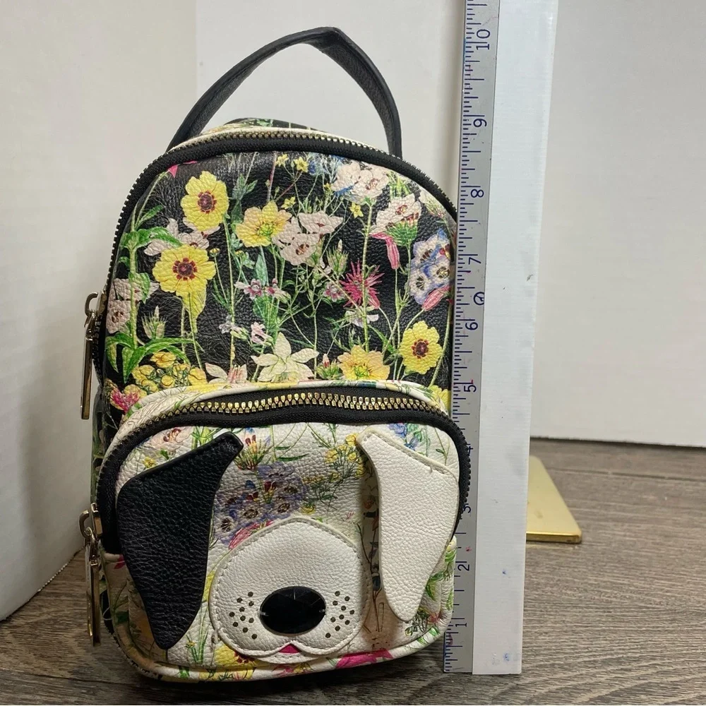 Betsey Johnson Floral Dog Mini Backpack purse. Pre-owned slight wear.